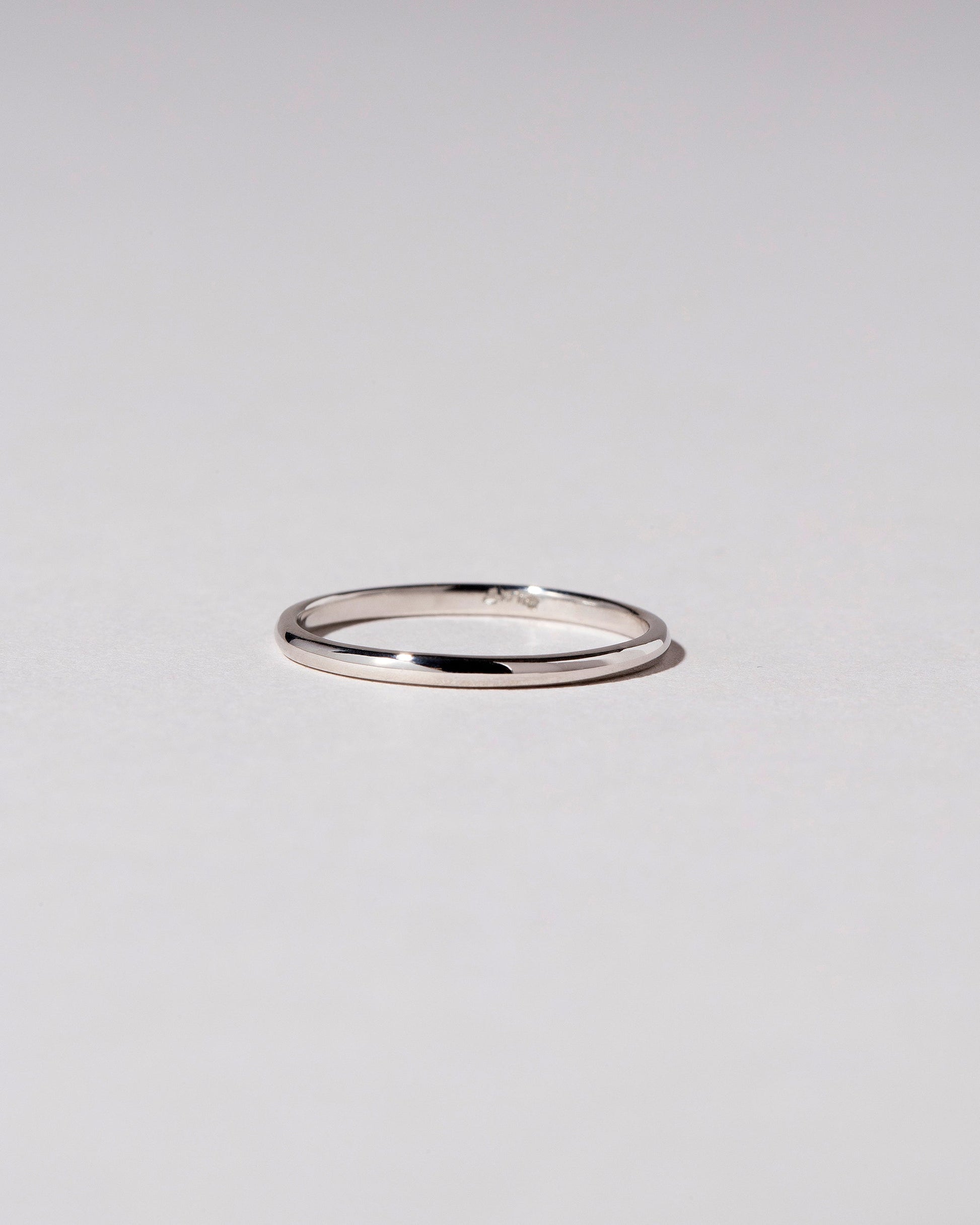 Platinum 1mm Half Round Band on light color background.