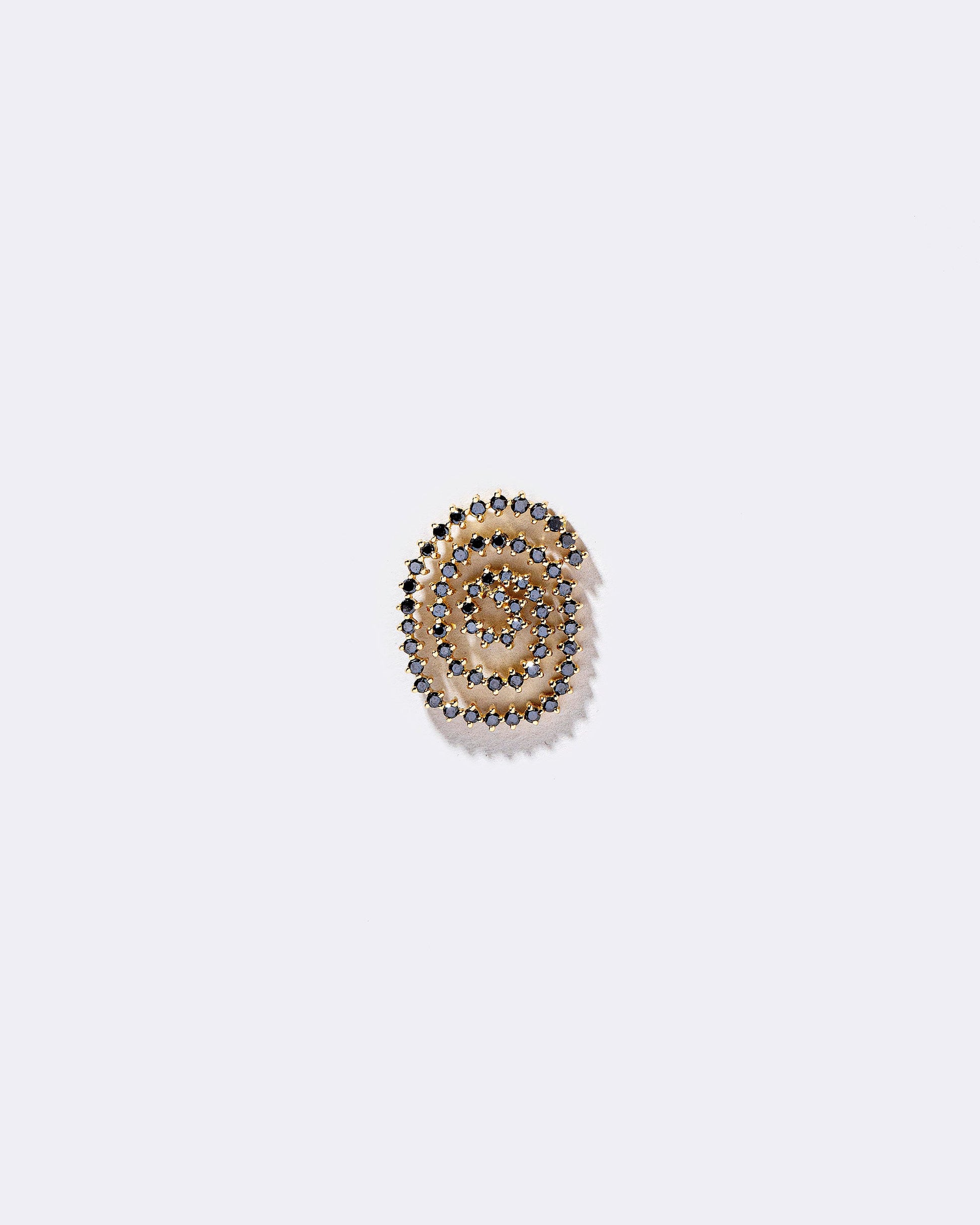 Right Black Diamond Cycle of Rebirth Earring Single on light color background.