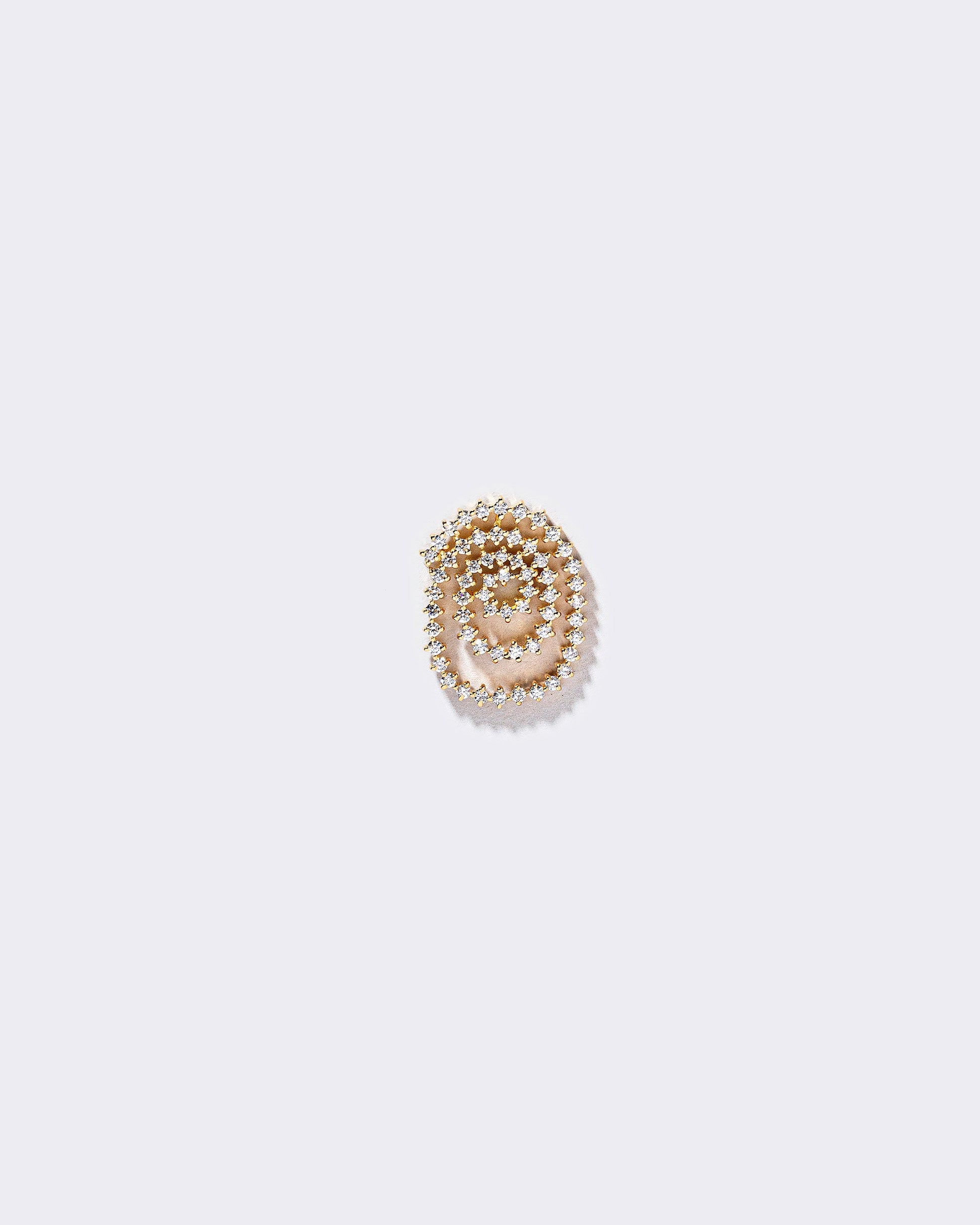 Left White Diamond Cycle of Rebirth Earring Single on light color background.