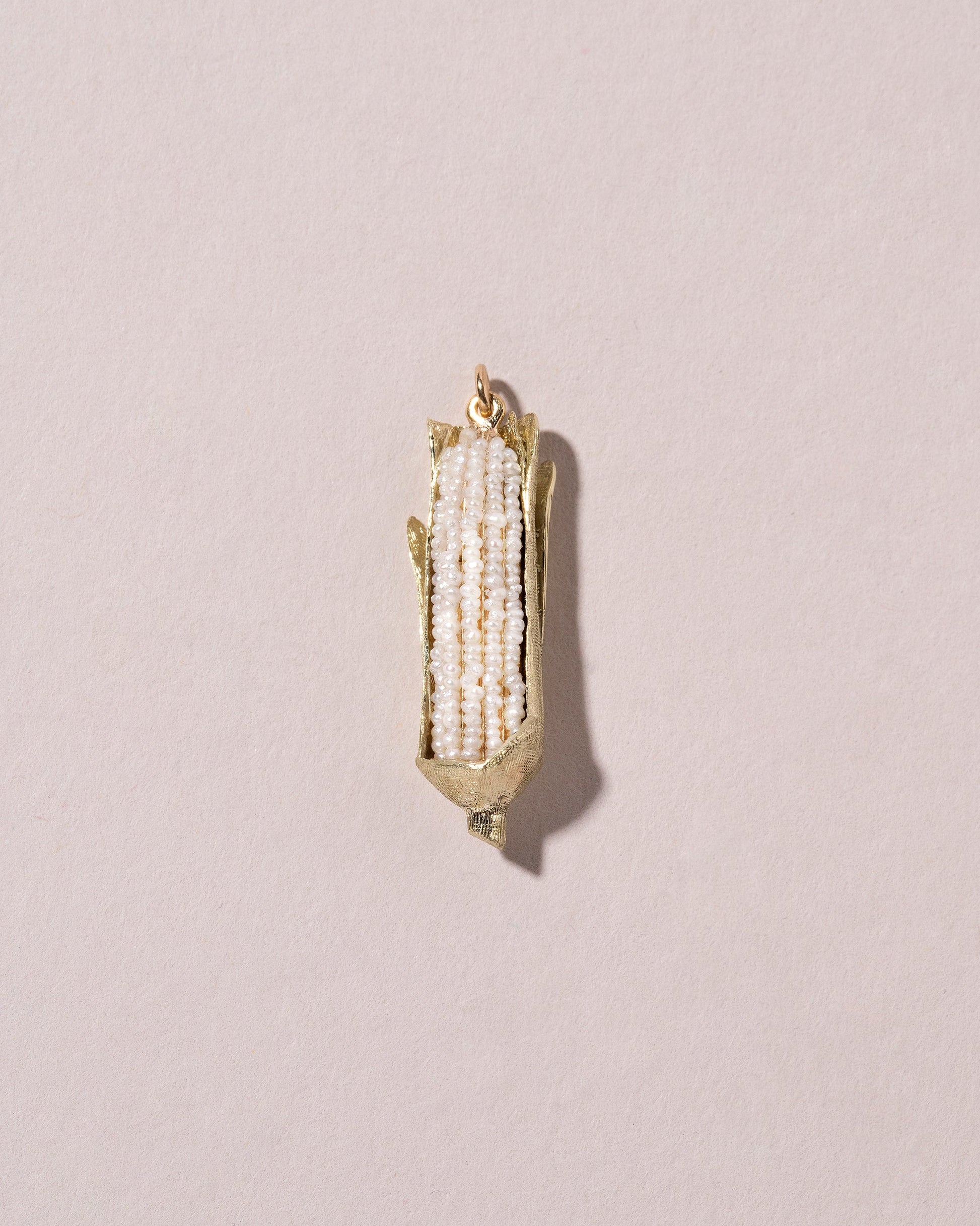  Corn on the Cob Charm on light color background.
