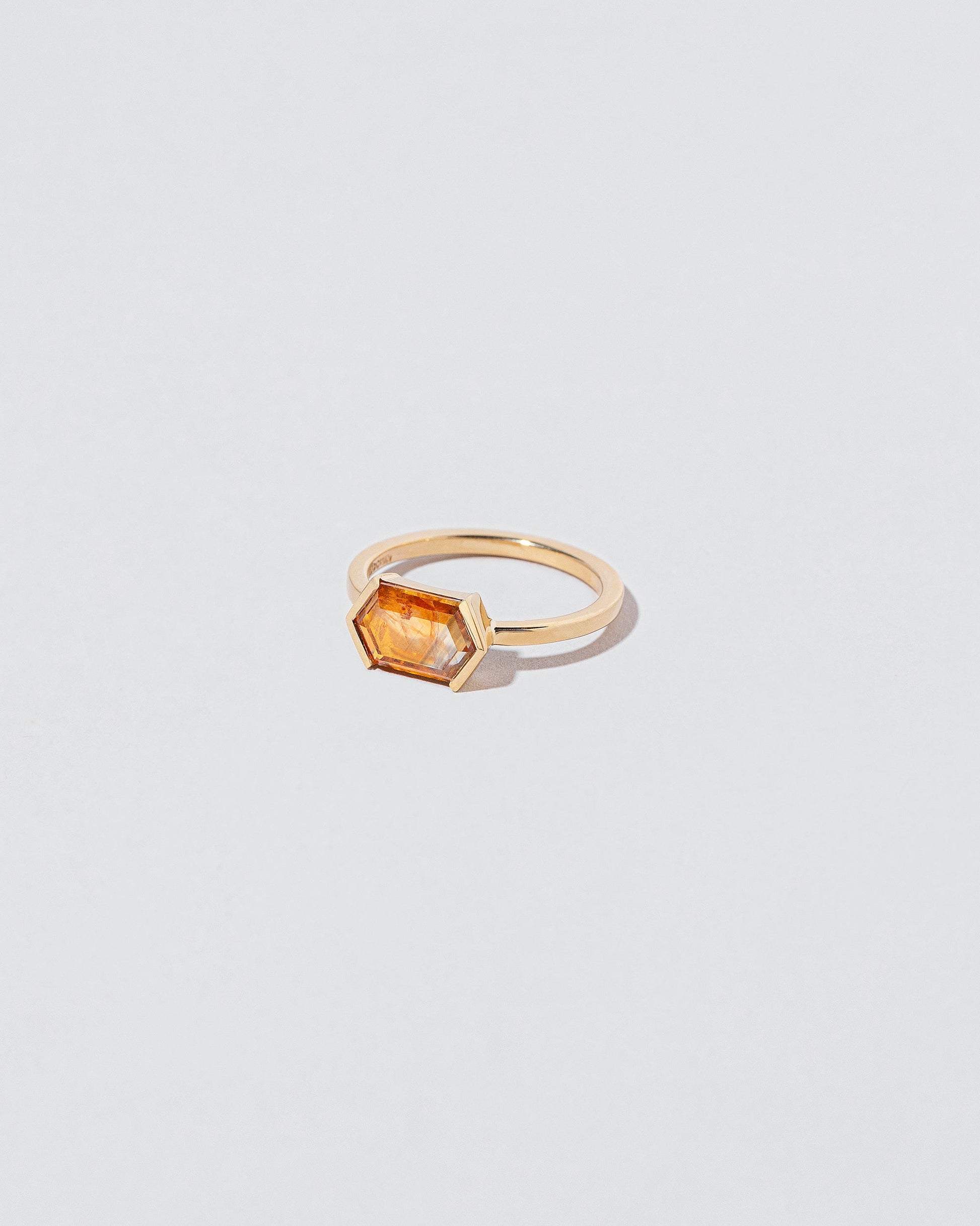 View from the side of the Dawnstar Ring on light color background.