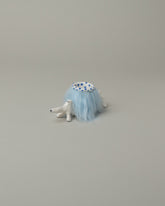 Eleonor Boström Blue Furry Baggage Dog on light color background.