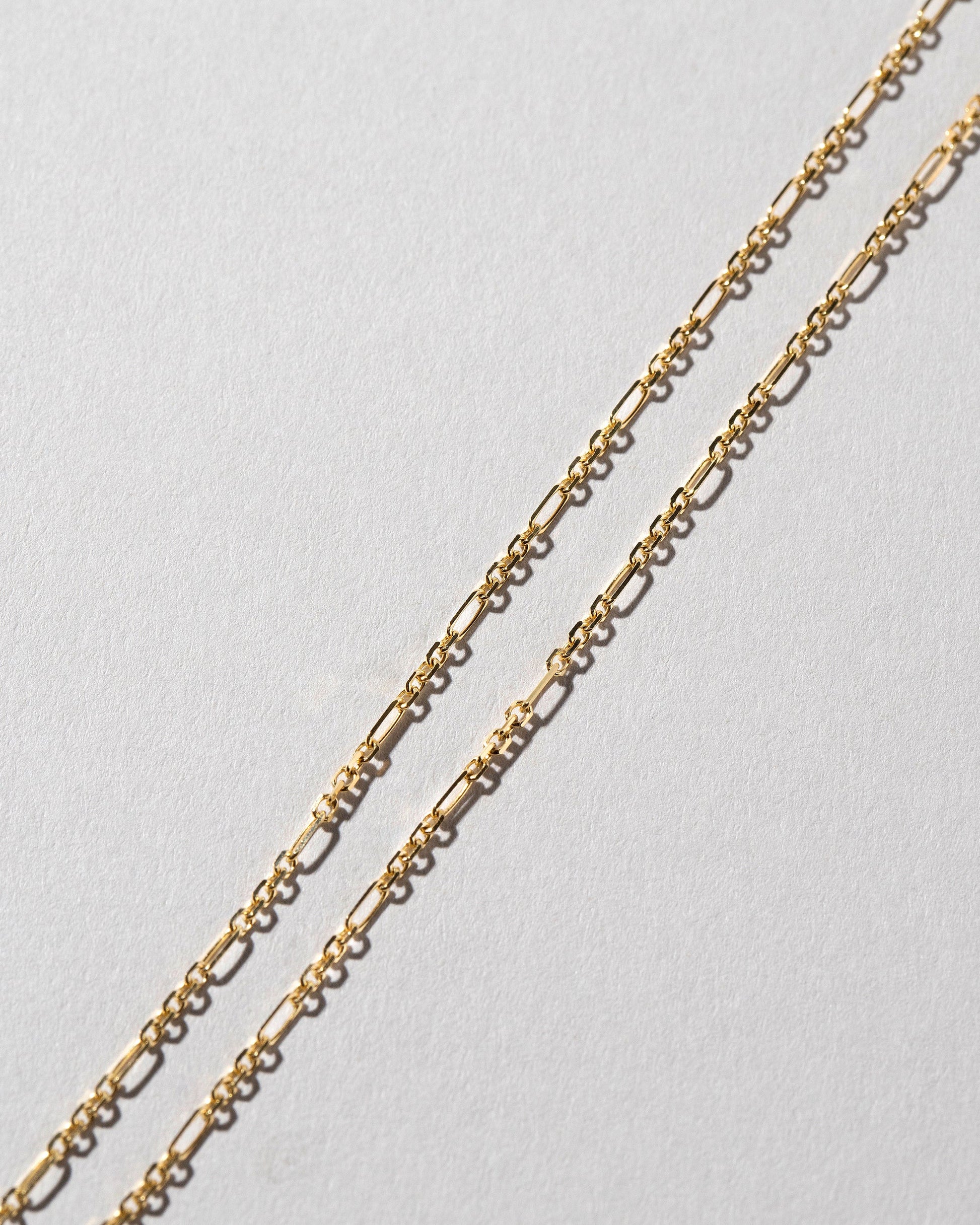 Closeup details of the Abacus Chain Necklace on light color background.