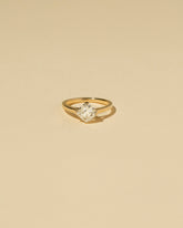 Cushion Modified Brilliant Diamond Solitaire Ring on light color background.