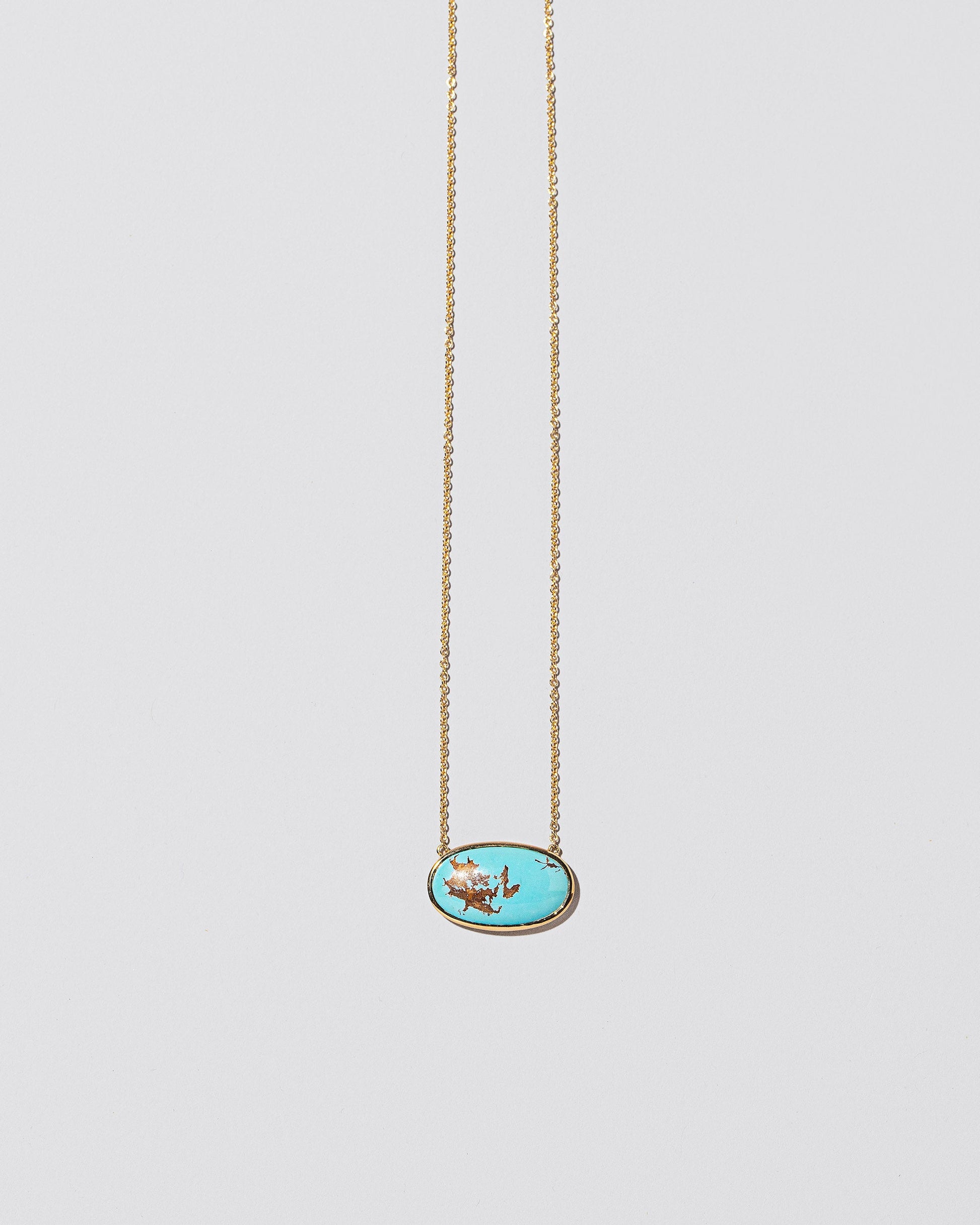 Tranquility Necklace on light color background.