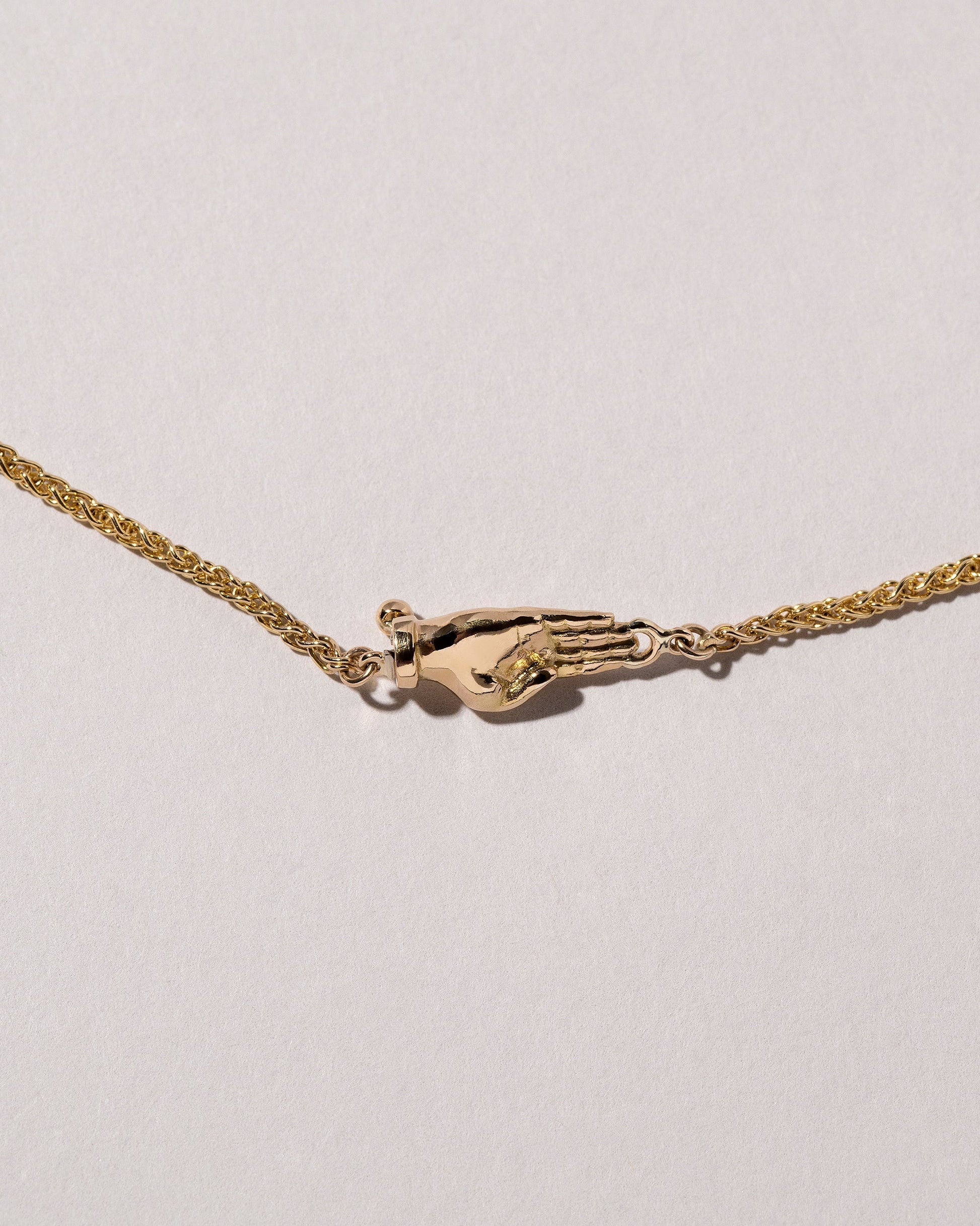 Manifestation Necklace on light color background.