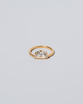 Plié Ring on light color background.