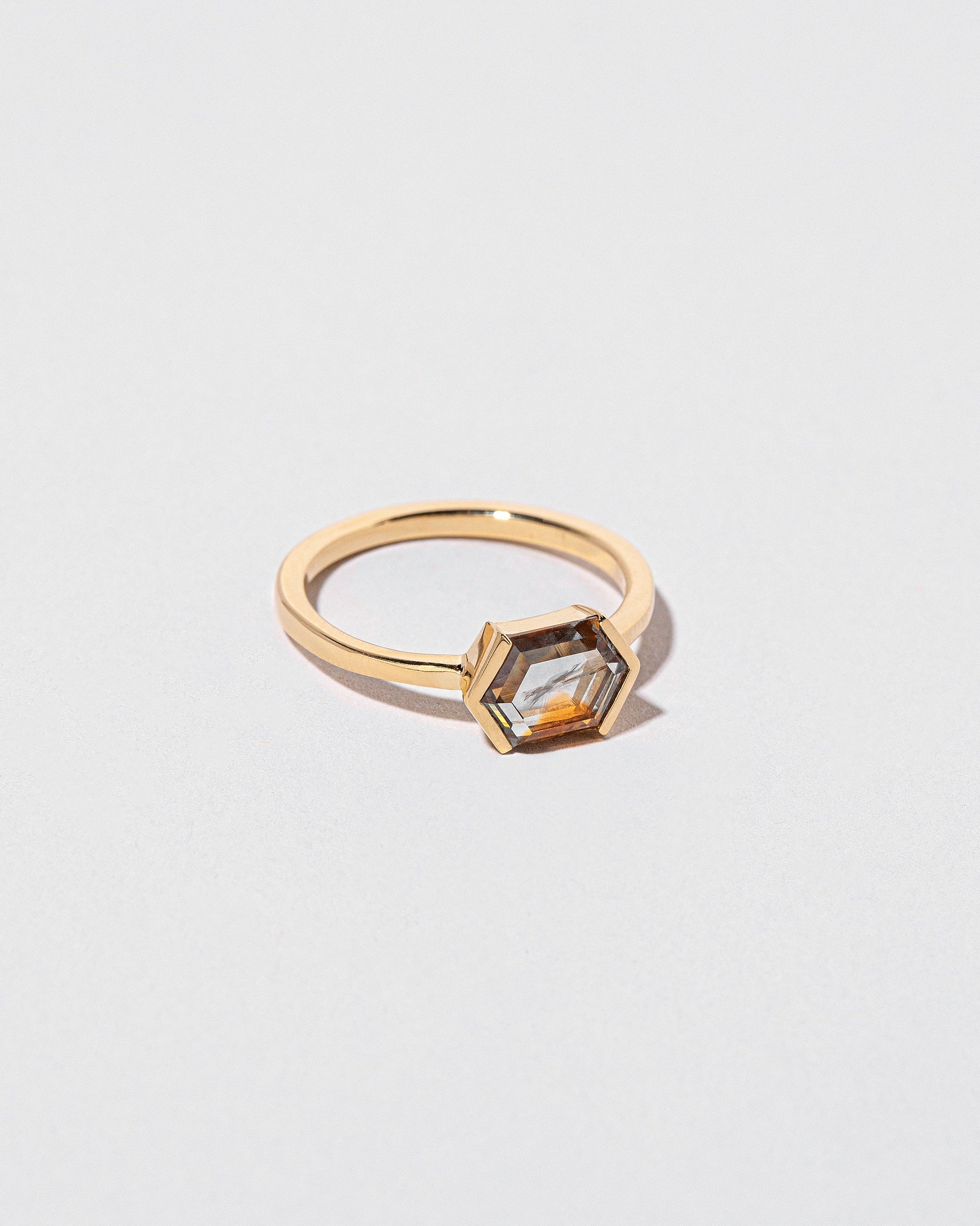 View from the side of the Amber Ring on light color background.