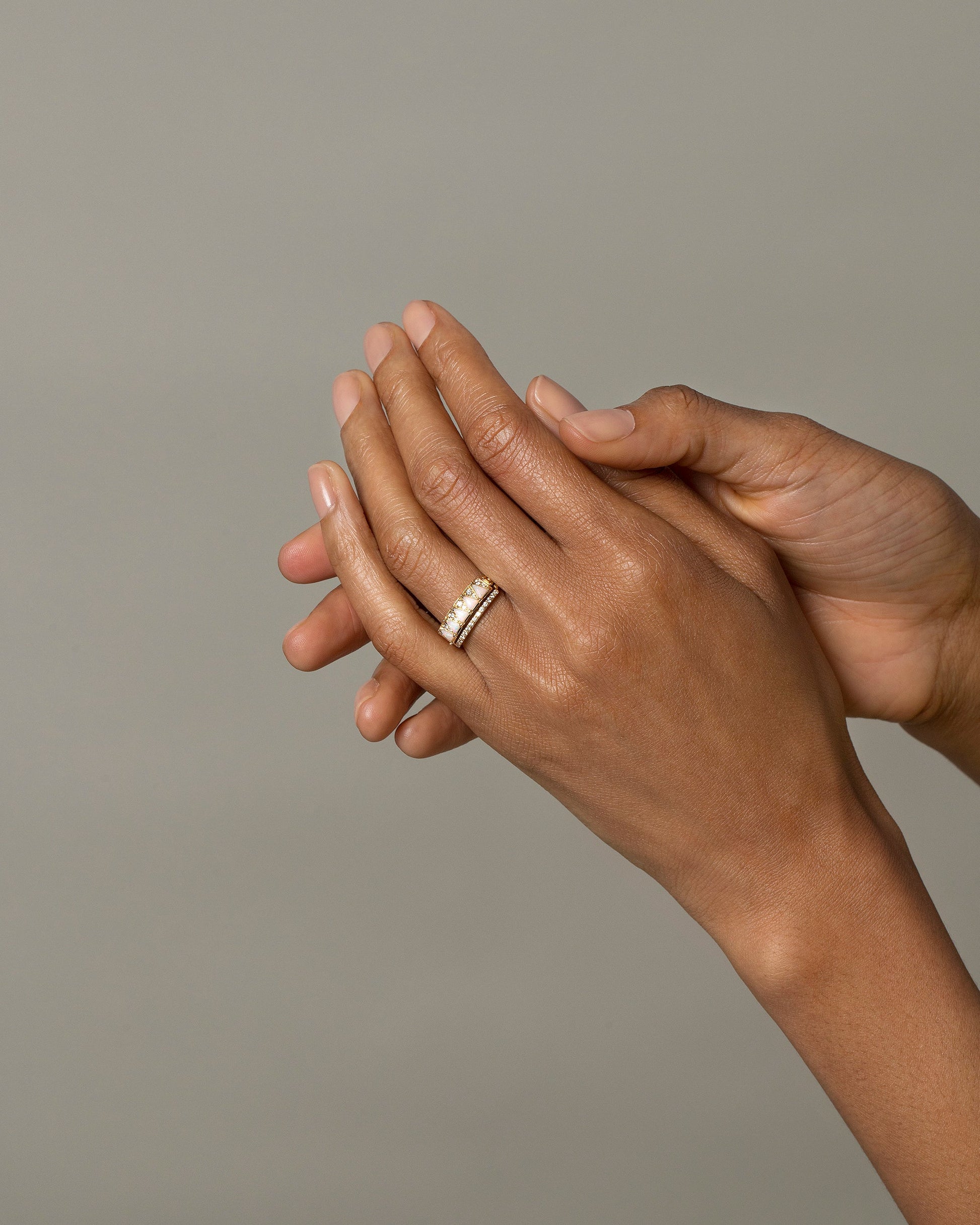 Gold Notched Band and Gold White Opal Five Triangle Ring on model.