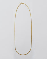 1mm Ritual Chain Necklace on light color background.