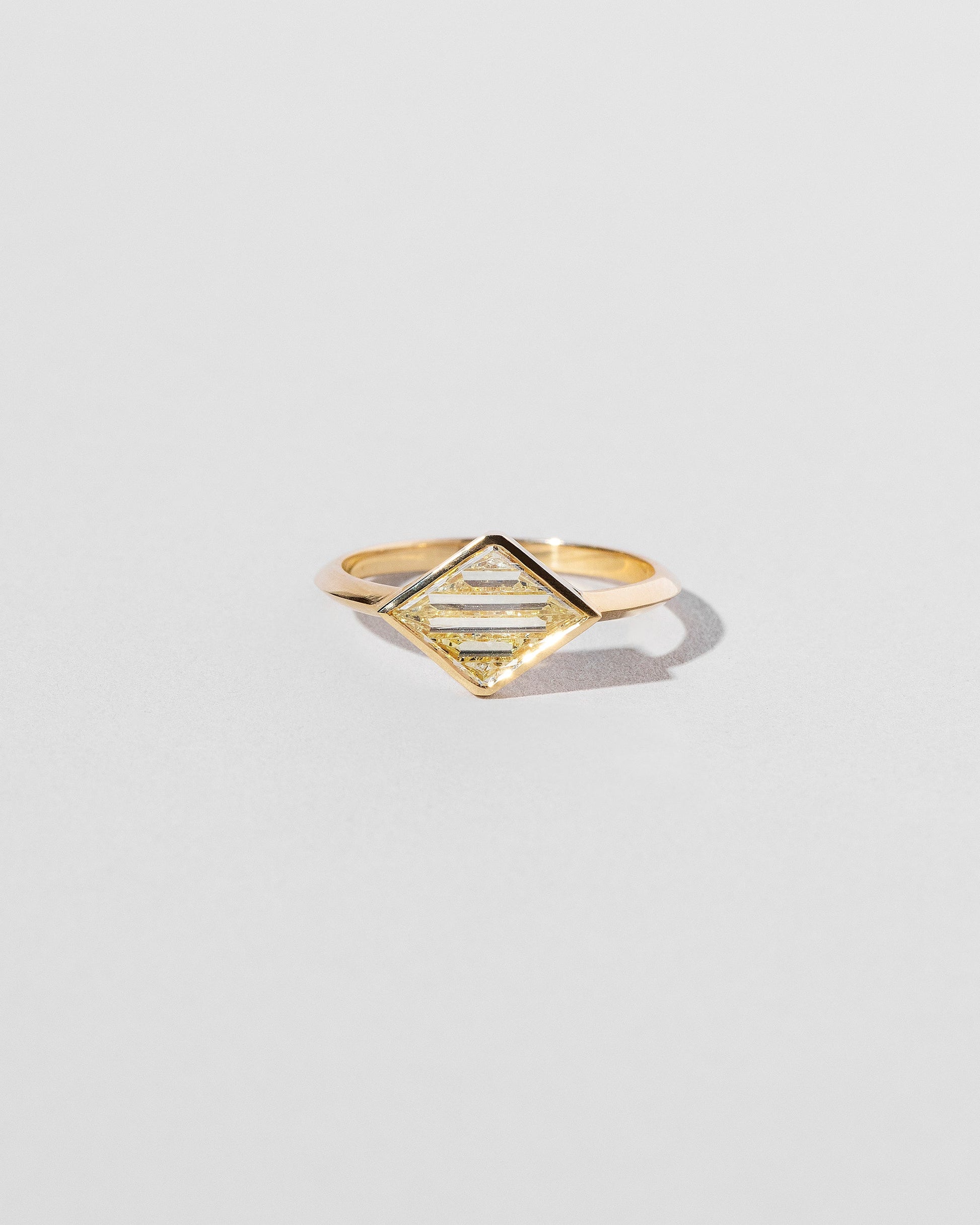 Aidos Ring on light color background.
