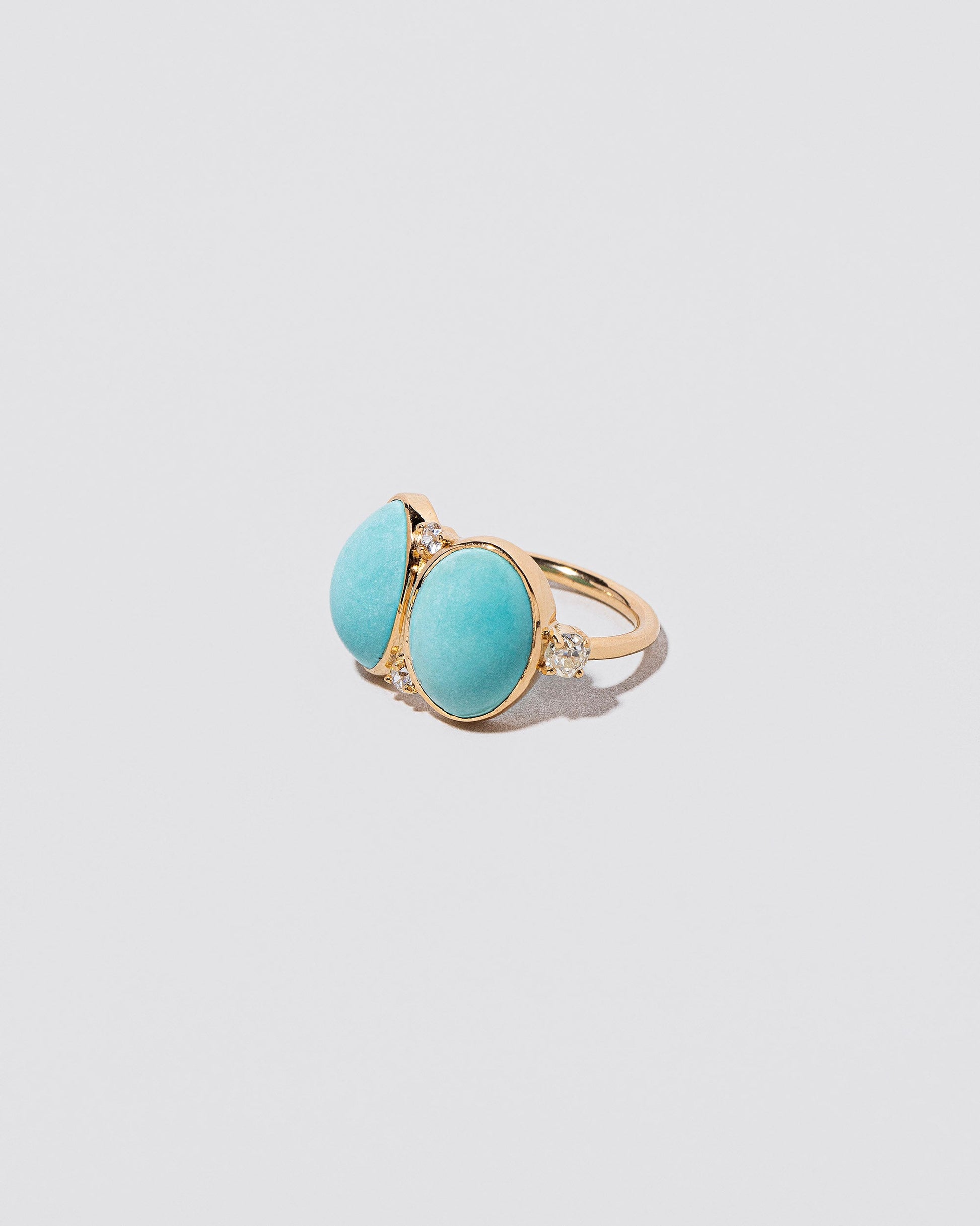 In-Between Ring on light color background.