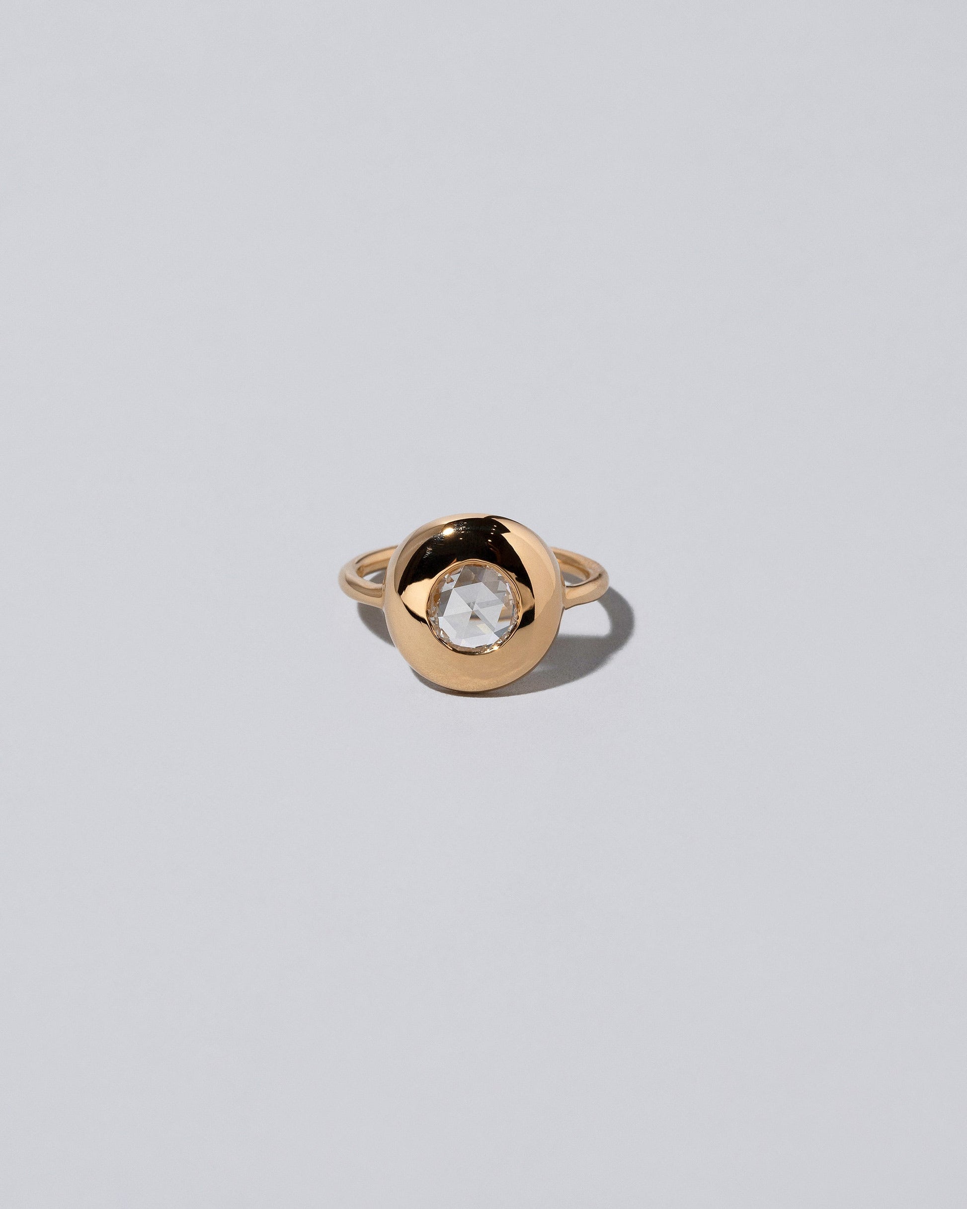 Exposition Ring on light colored background.