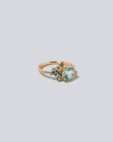 View from the side of the Tourmaline Vega Ring on light color background.