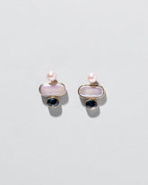  Mantle Earrings on light color background.
