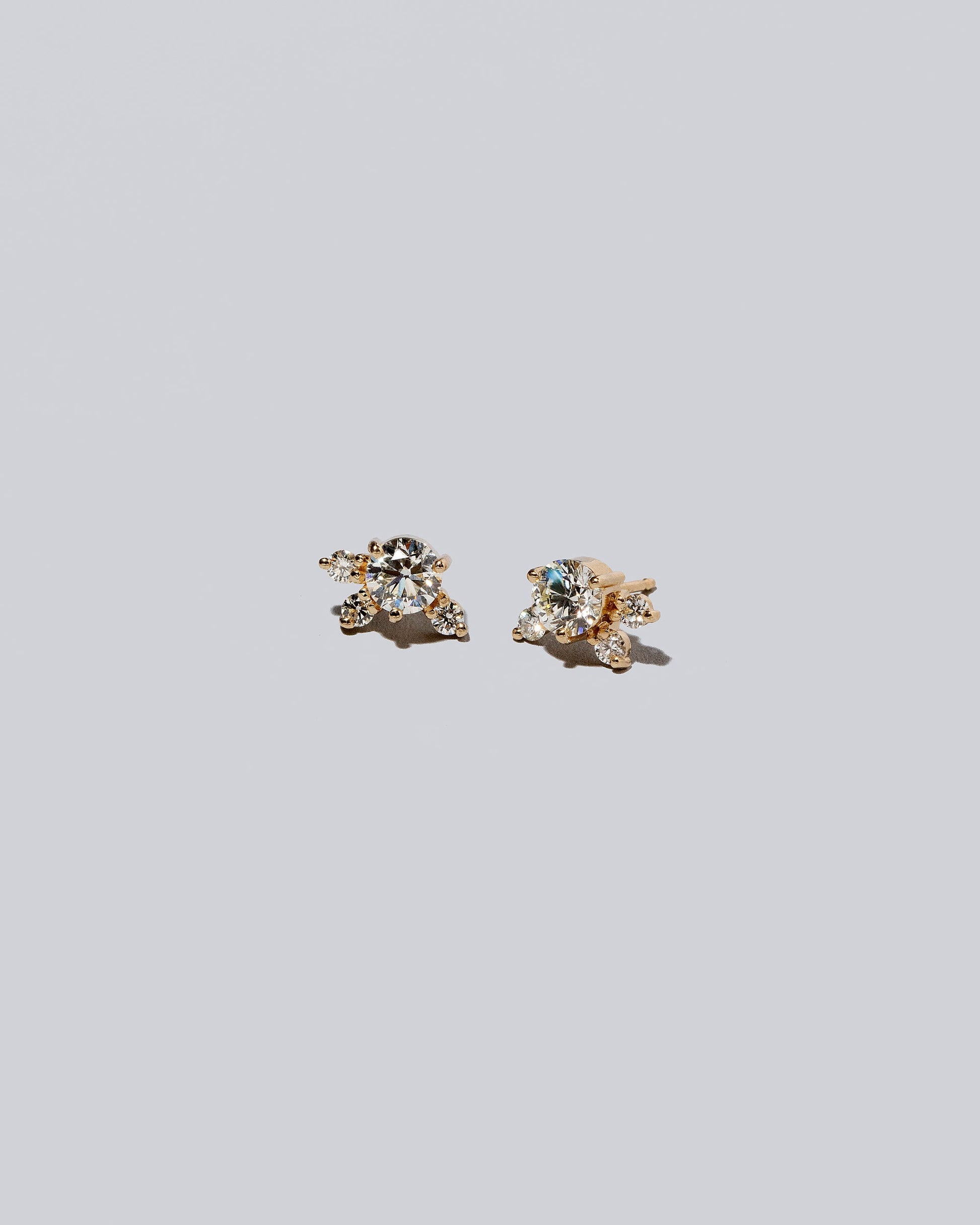 Product photo of Cluster Stud Earrings on a light color background.