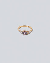 Purple Sapphire & Champagne Diamond Orion Ring on light color background.