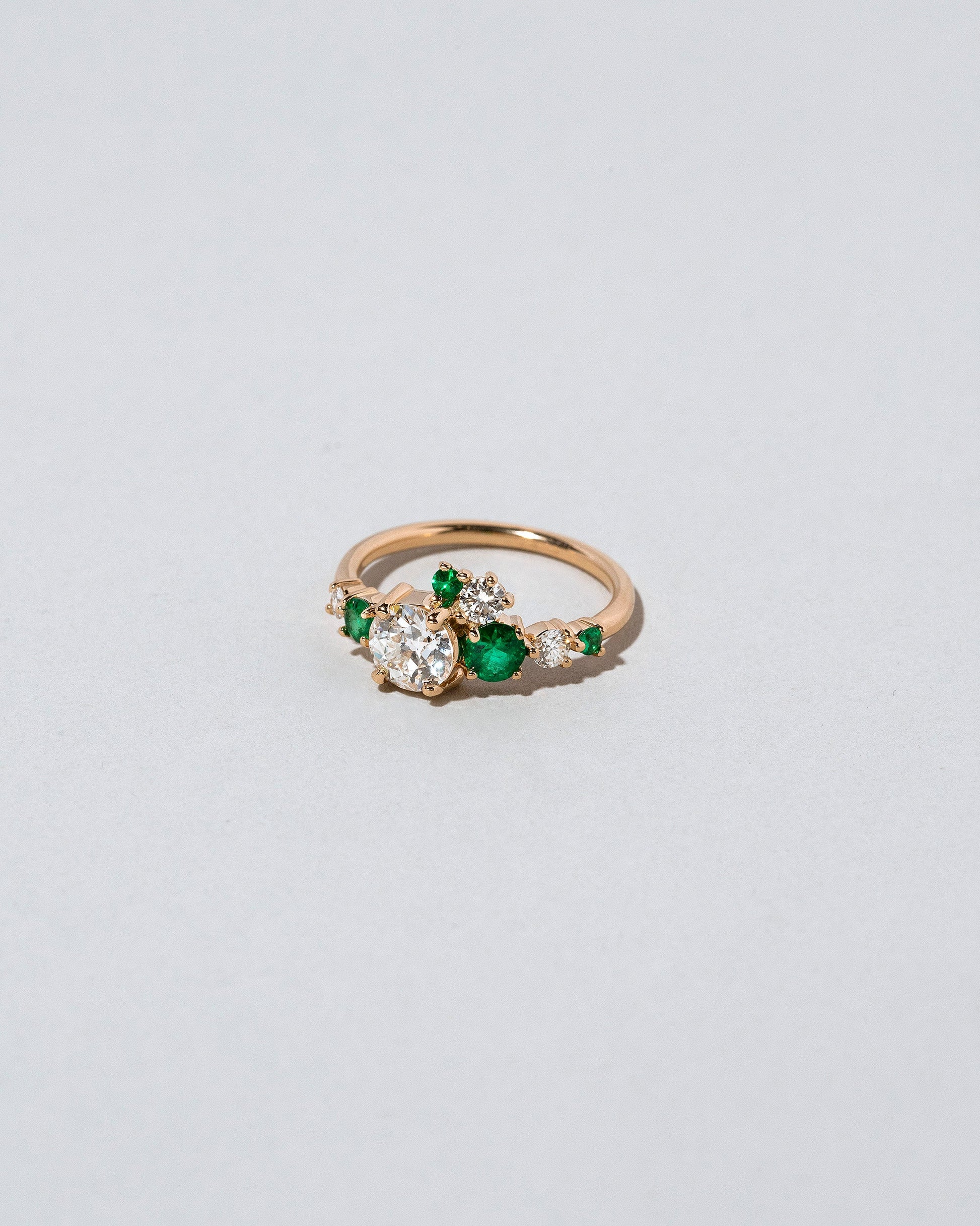  Luna Ring - White Diamond & Emerald on light color background.