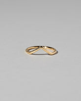 Gold Solid Round Wire High Peak Band on light color background.