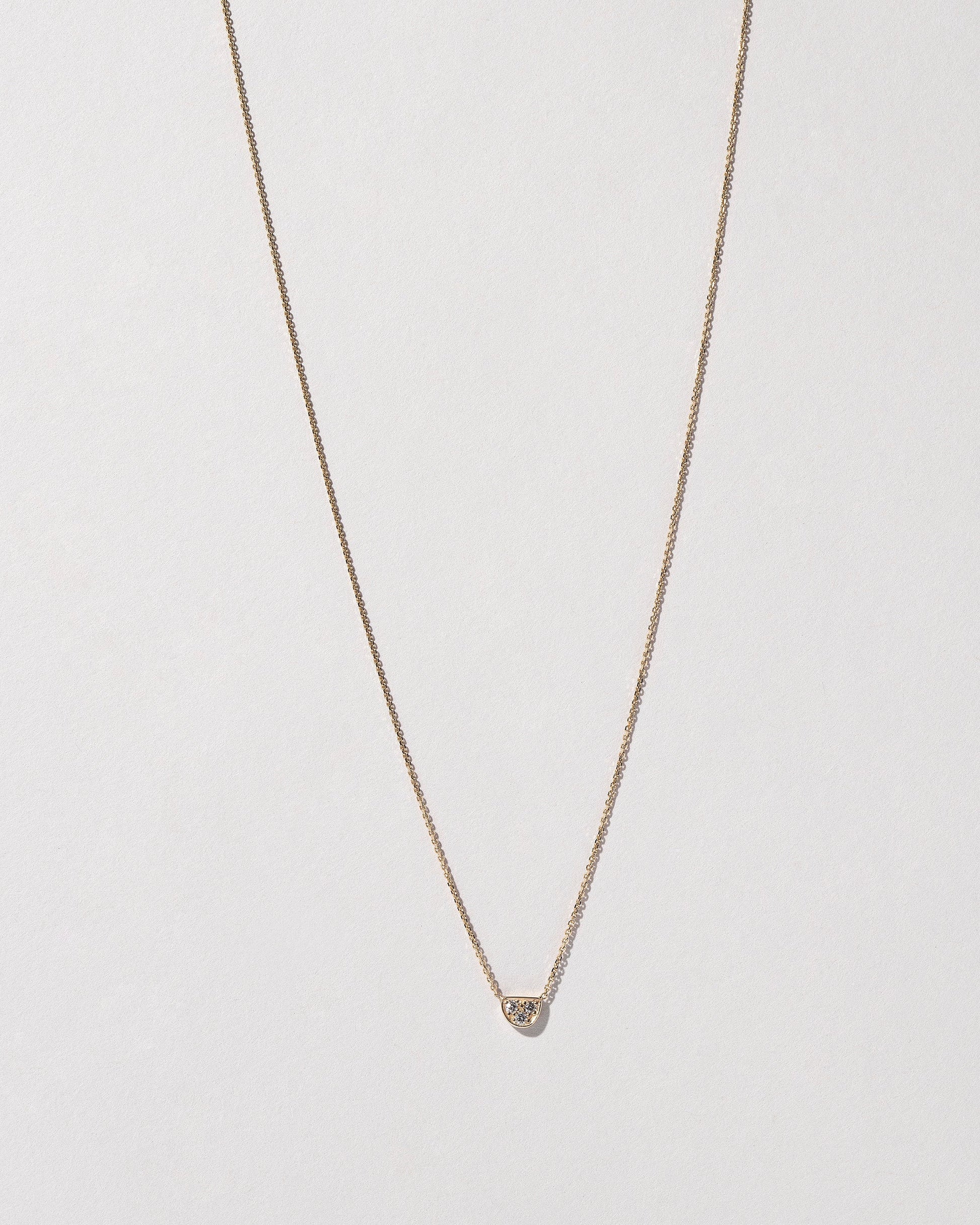  Half Moon Necklace on light color background.