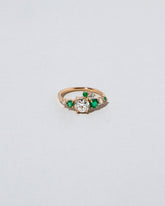  Luna Ring - White Diamond & Emerald on light color background.