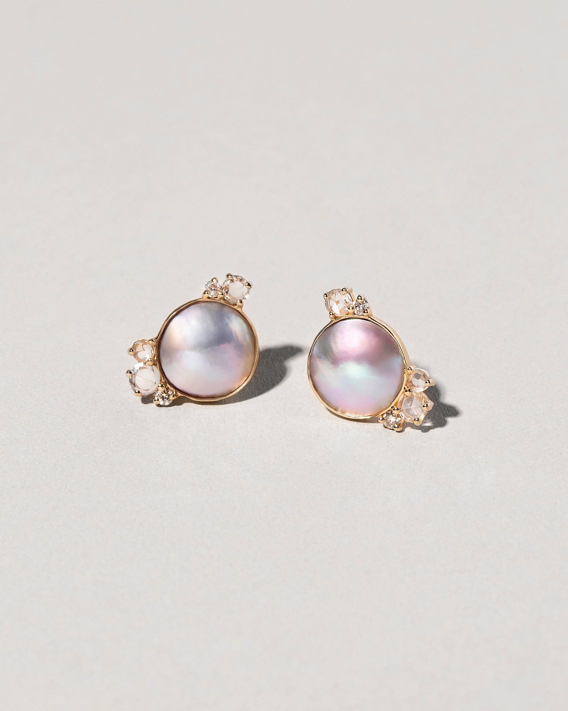  Mabe Pearl Cluster Earrings on light color background.