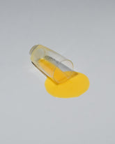Spills Faux Diner Orange Juice Spill on light color background.