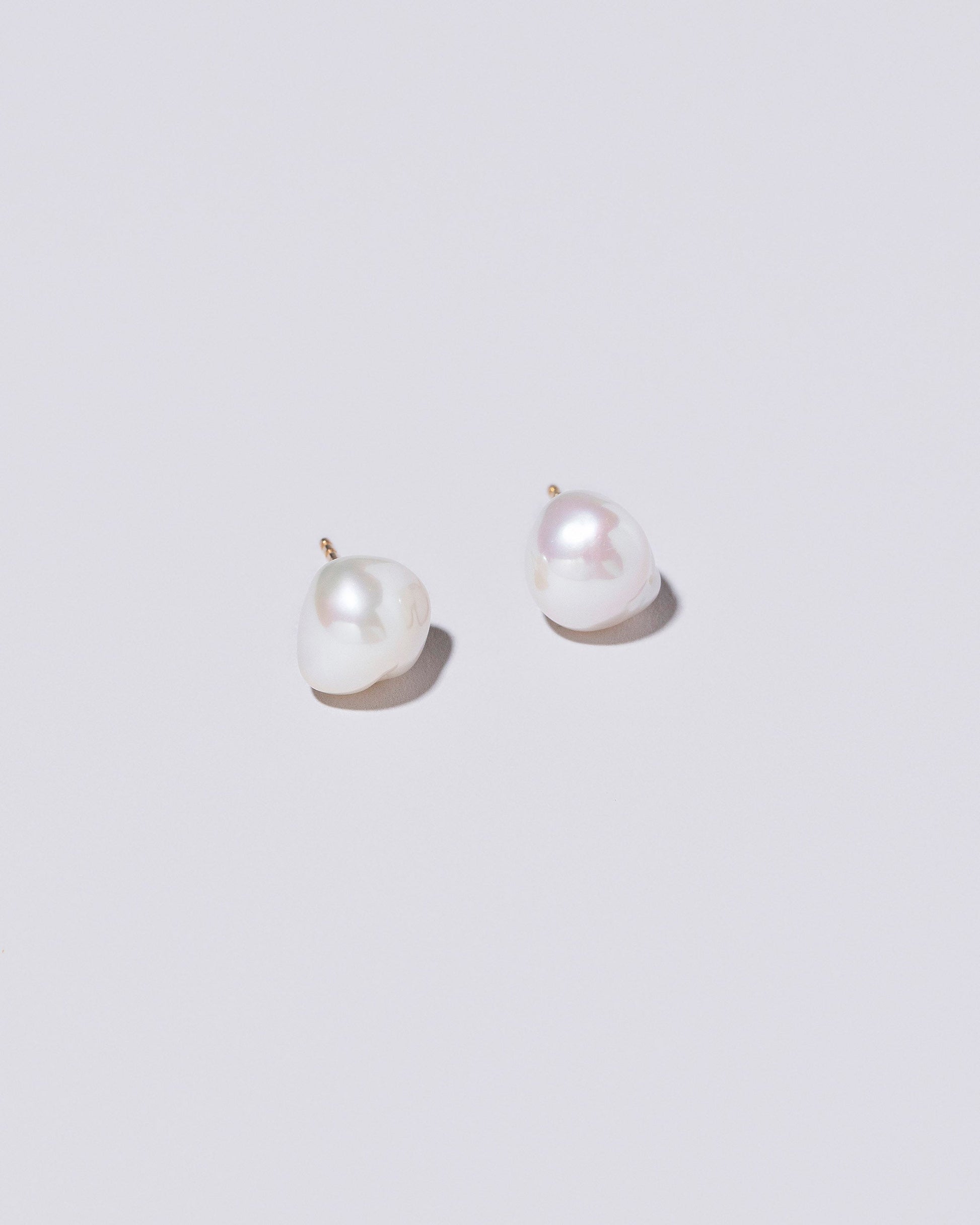  Lagniappe Pearl Stud Earrings on light color background.