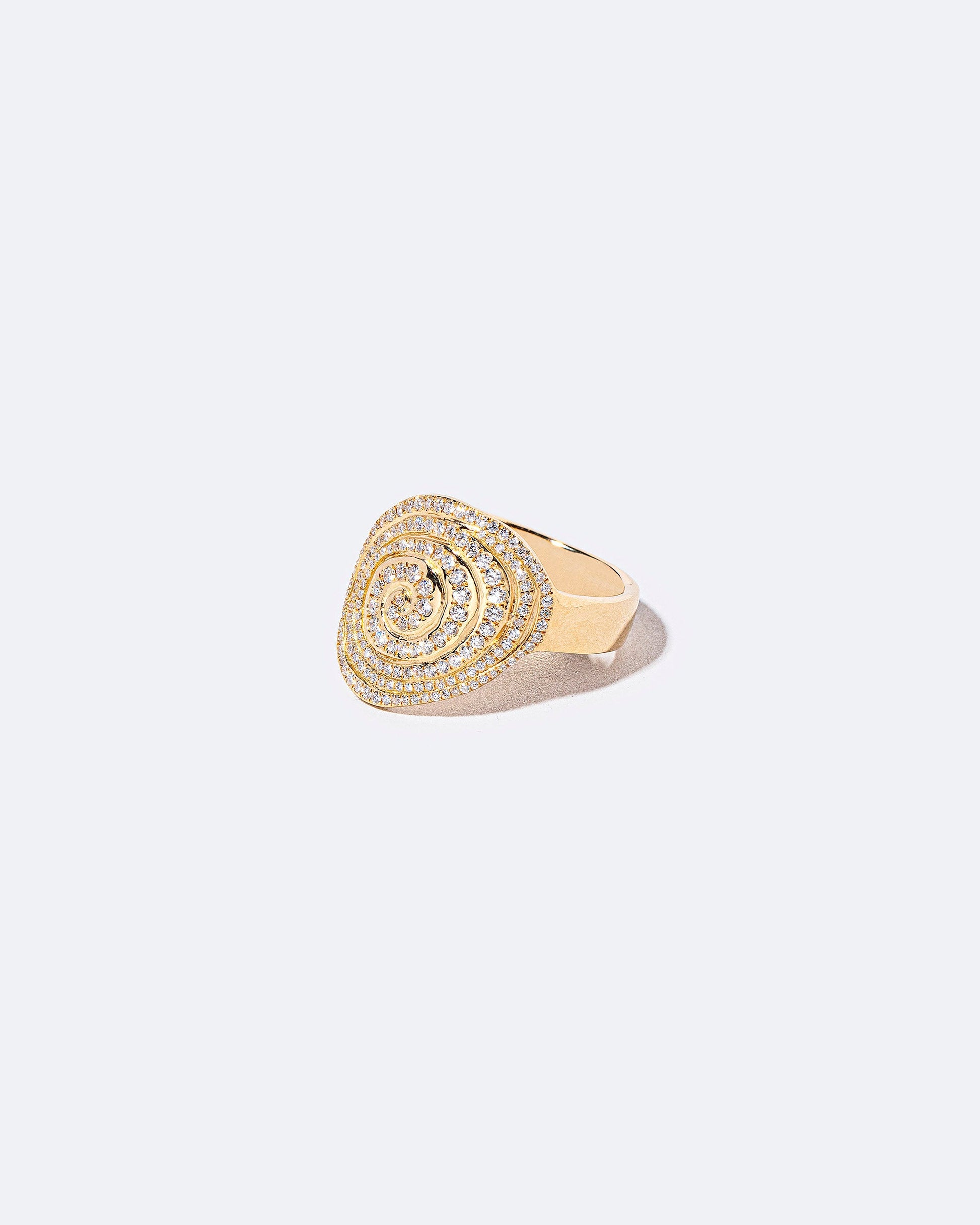View from the side of the White Diamond Lifecycle Ring on light color background.