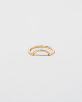 Gold Square Wire Curve Band on light color background.