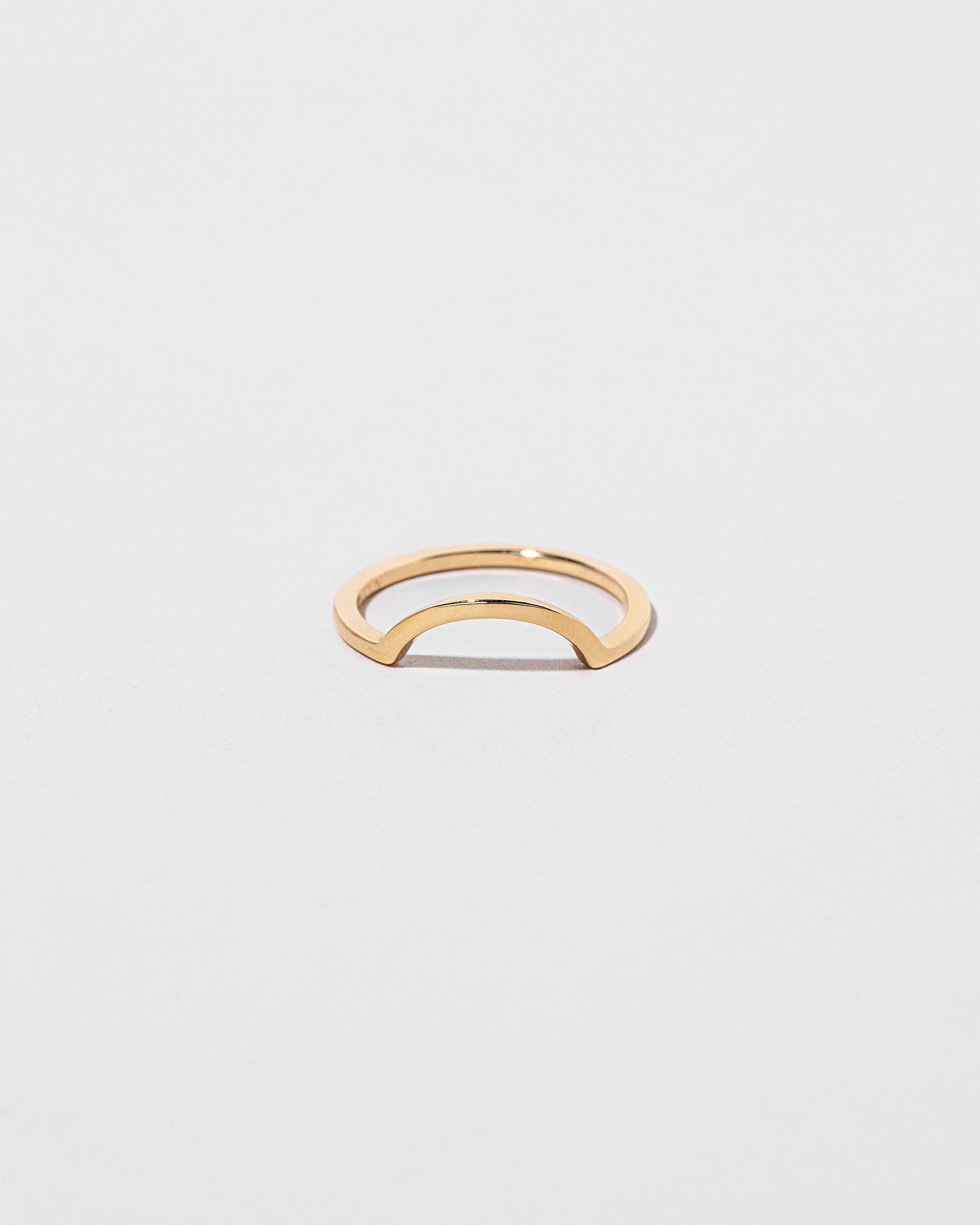 Gold Square Wire Curve Band on light color background.