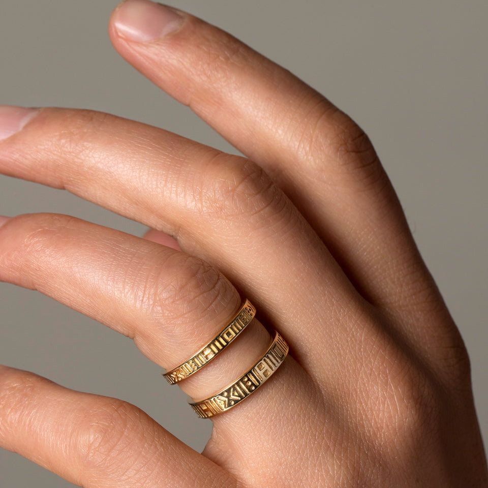 product_details::Gold Infinity Etched Bands on male model.