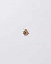 Mini White Diamond Left Spiral Stud Earring Single on light color background.