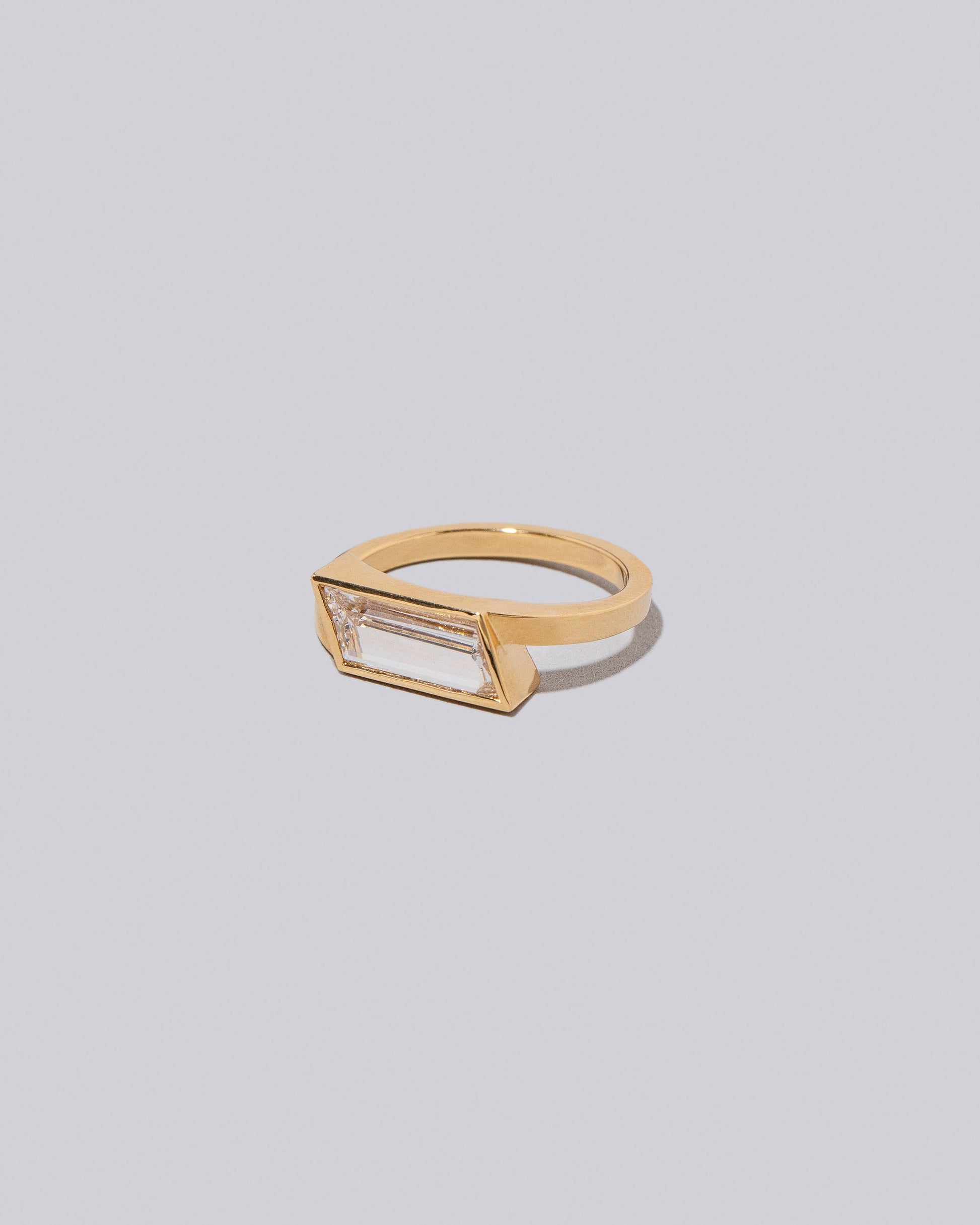 View from the side of the Melody Ring on light color background.