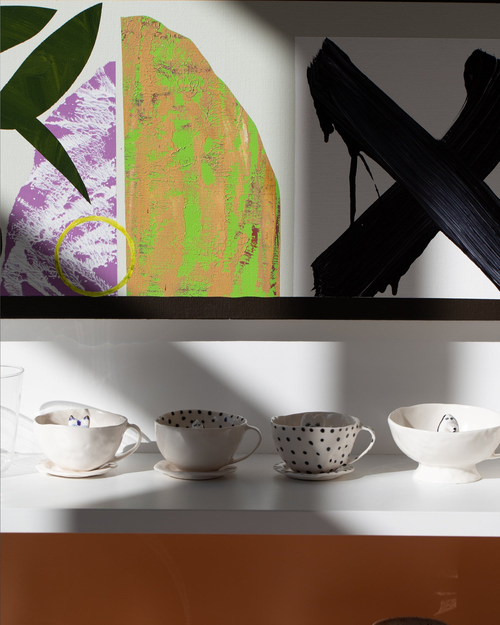 Styled image featuring the Eleonor Boström Black Spots Cat Tea Cup with Saucer and Spotty Dog Tea Cup & Saucer, among others.