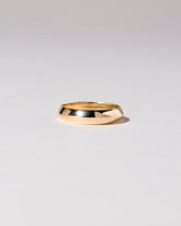 Gold 5mm Knife Edge Band on light color background.