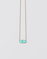 Waters Necklace on light color background.