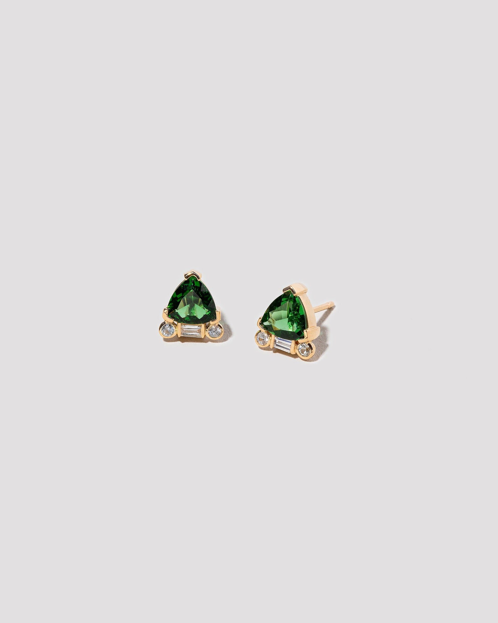  Rise Earrings on light color background.