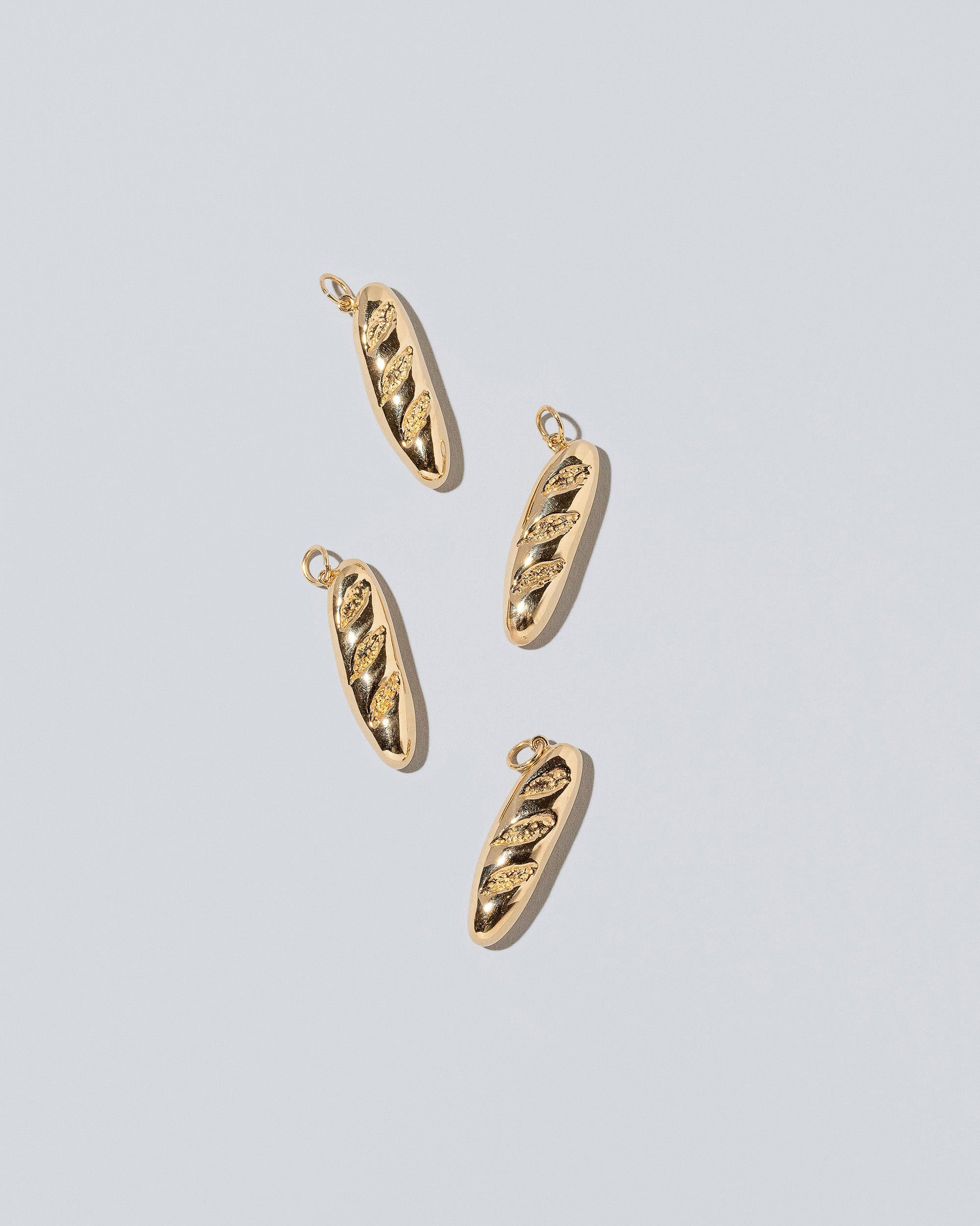 Demi Baguette Charms on light color background.