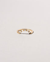 Gold Baguette Curve Band on light color background.