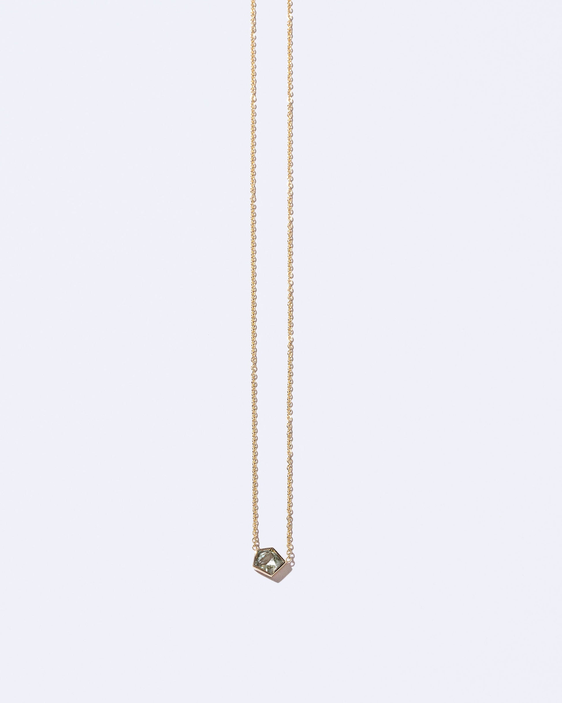 Sagan Necklace on light color background.