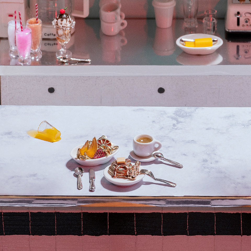 product_details::Styled image featuring the Ruby Pavé Strawberry Charm, Orange Slice Charm, Melon Slice Charm, Short Stack Pancake Charm and Bacon Charm.