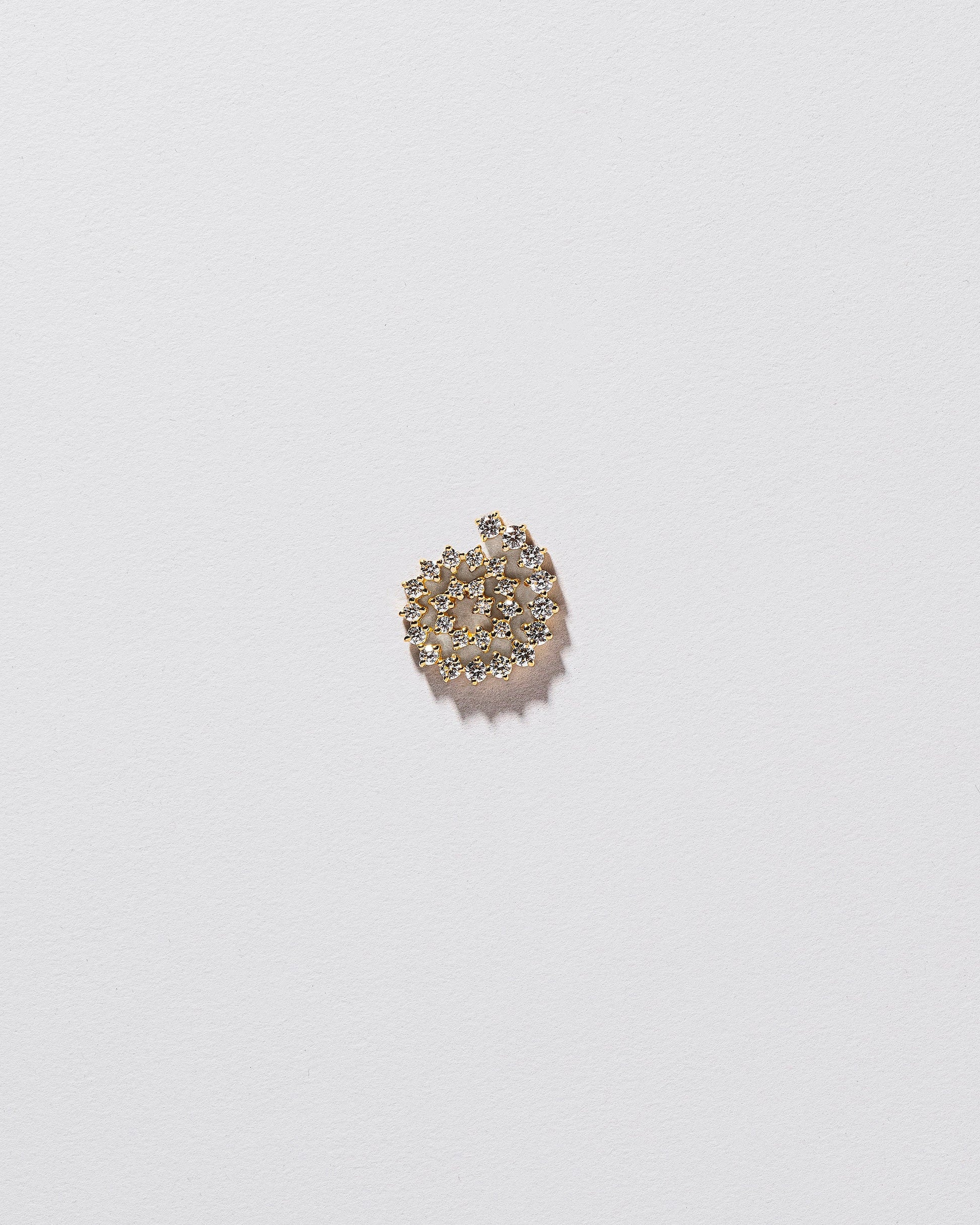 Full White Diamond Left Spiral Stud Earring Single on light color background.
