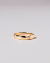 Gold 4mm Half Round Band on light color background.