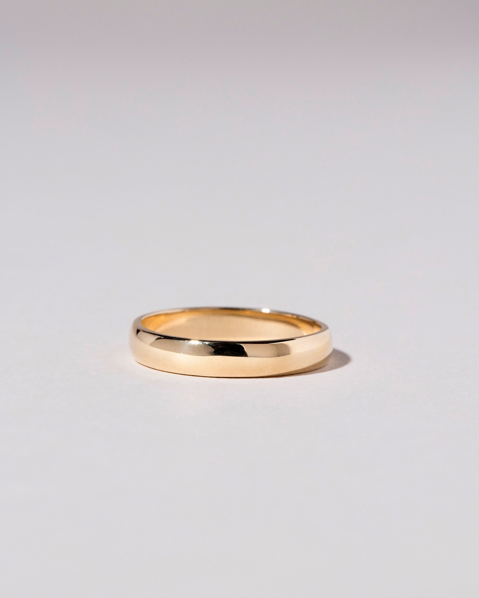 Gold 4mm Half Round Band on light color background.