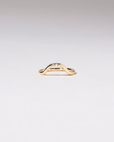 Gold Single Stone White Diamond Curve Band on light color background.