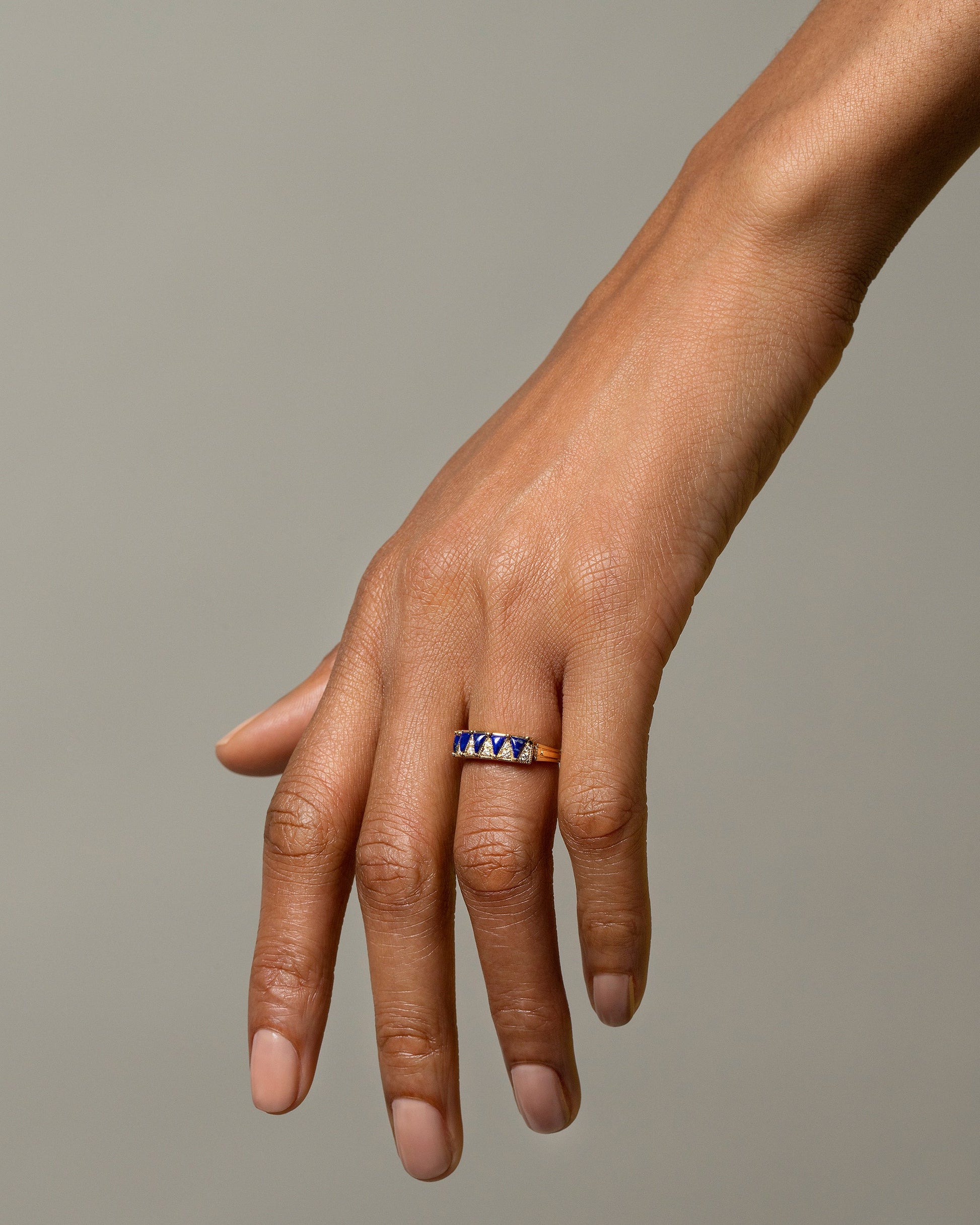 Gold Lapis Five Triangle Ring on model.