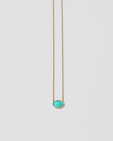 Heaven & Earth Necklace on light color background.