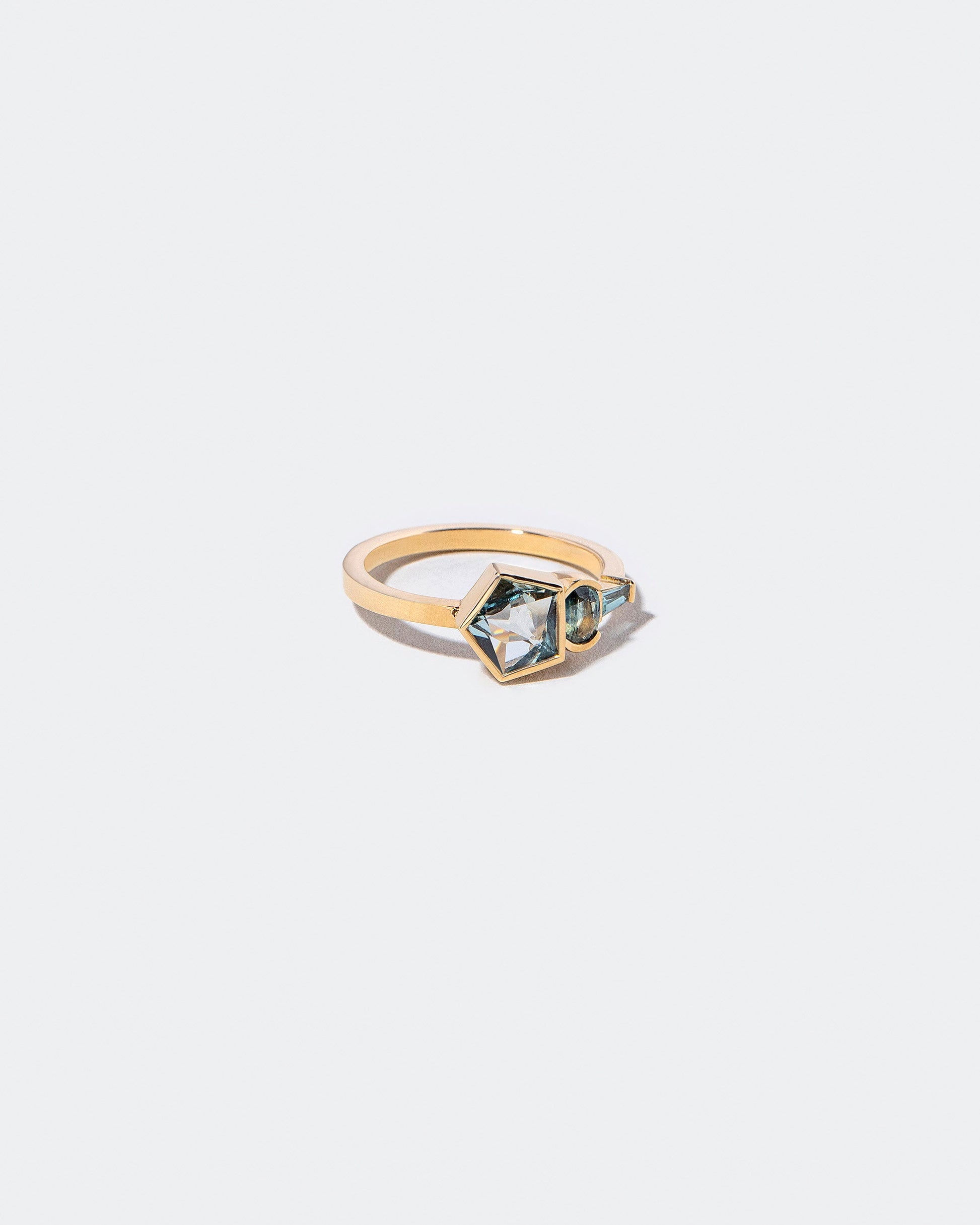  Syncretism Ring on light color background.