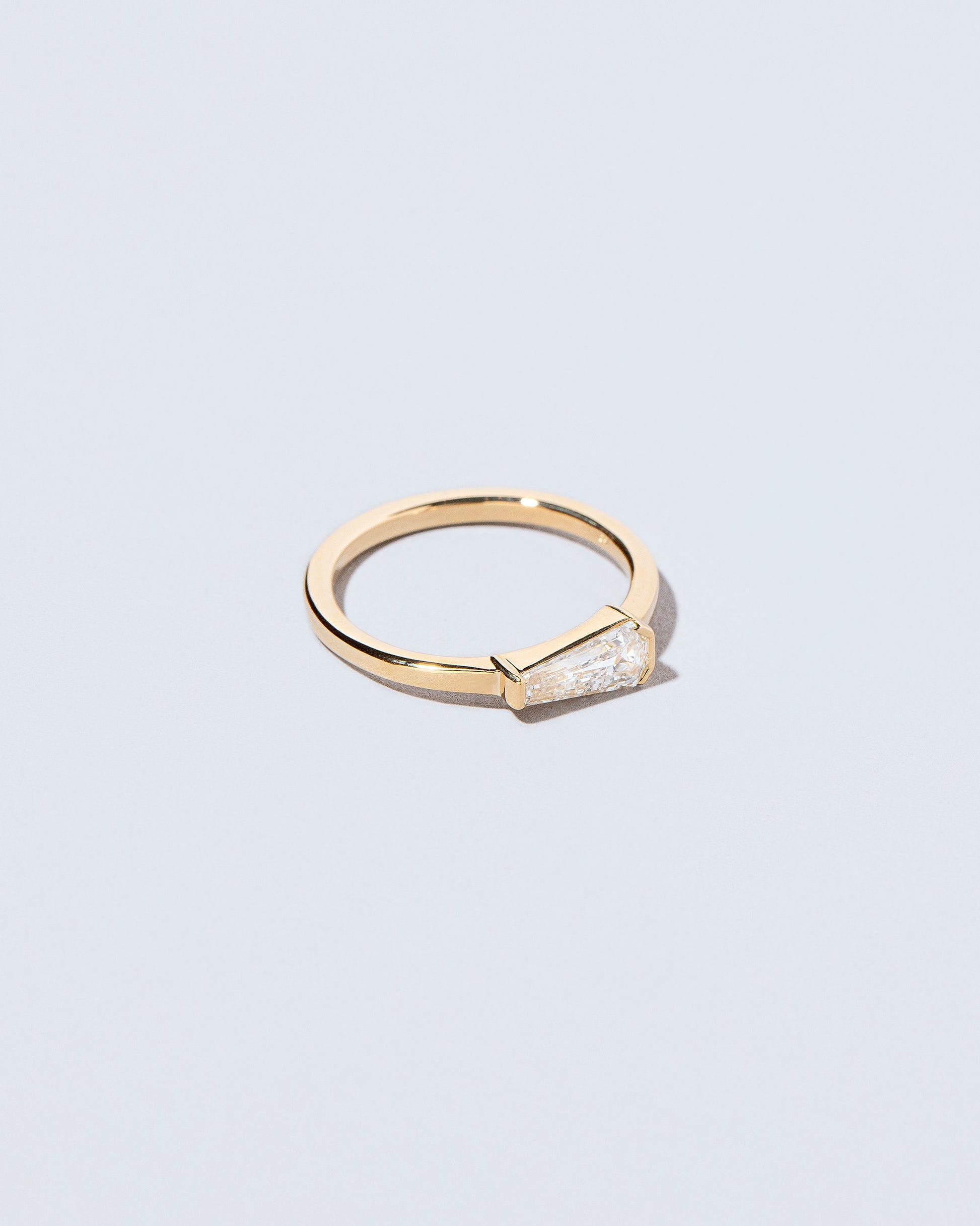 View from the side of the Niphredil Ring on light color background.
